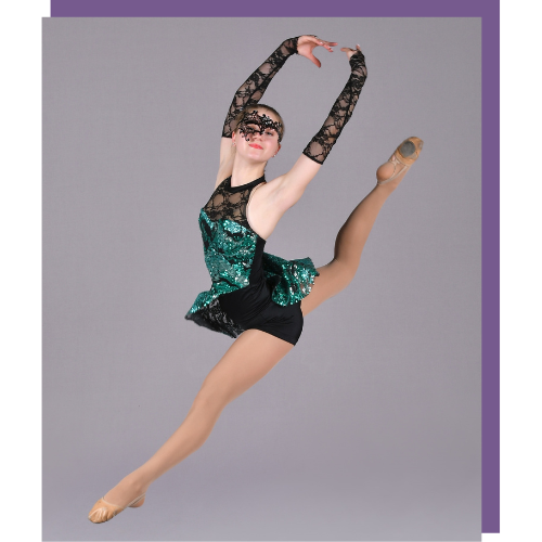a woman in a green and black dress is dancing