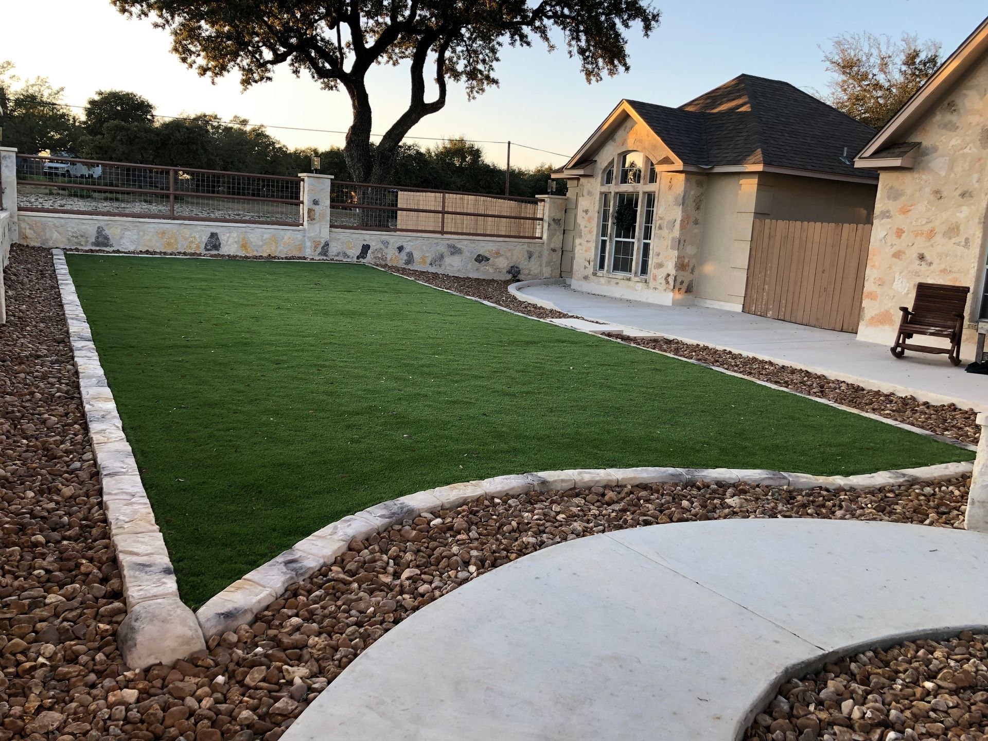 A house with a large lawn in front of it