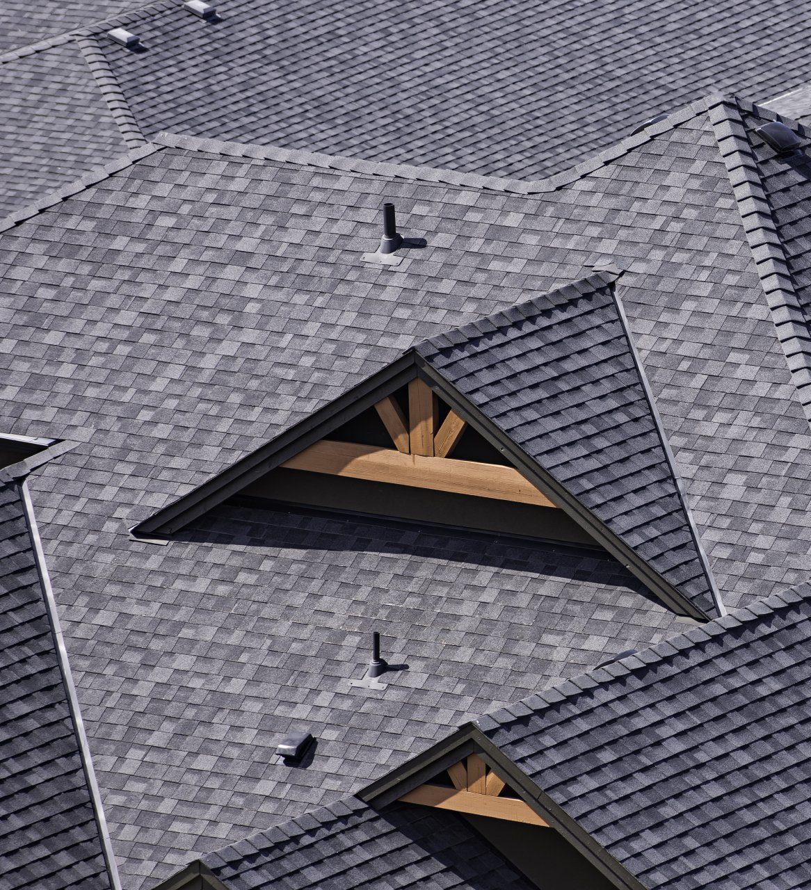 An aerial view of a roof with a triangle shaped window