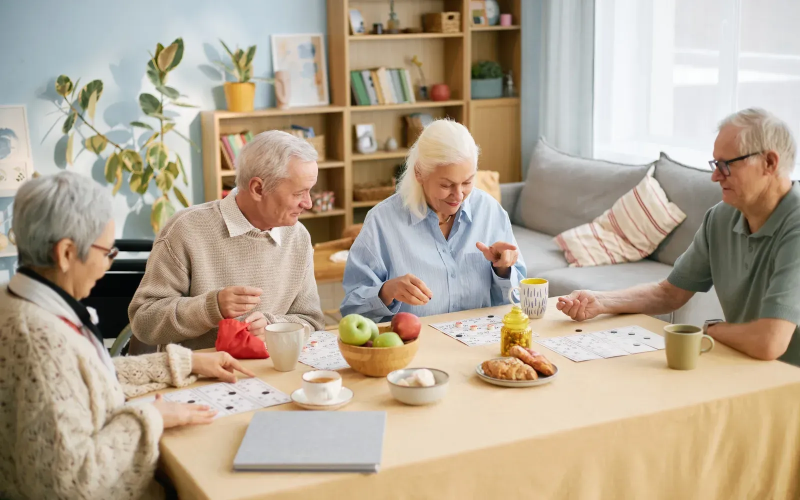 Seniors engaging in recreational activities and board games at an RPA retirement home.