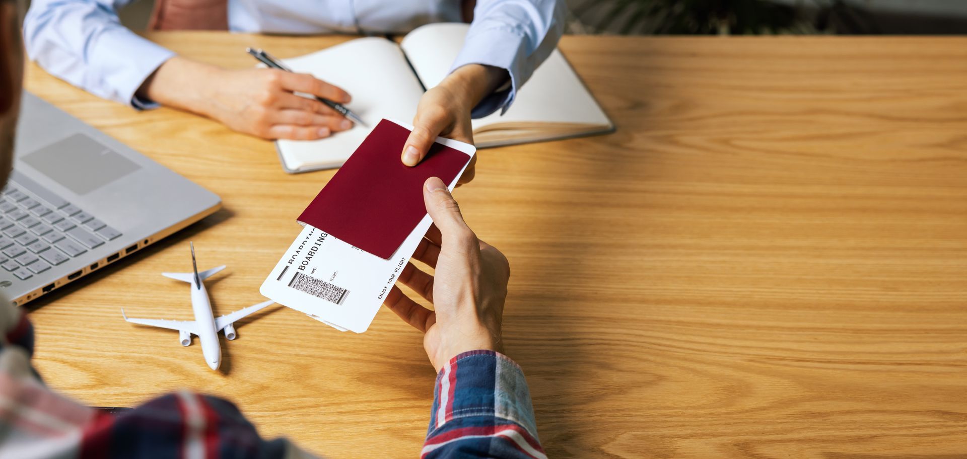 Travelers reviewing boarding passes and a map while planning their next trip