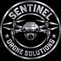 Silver circular logo reading &ldquo;SENTINEL DRONE SOLUTIONS&rdquo; with a drone centered on a black background