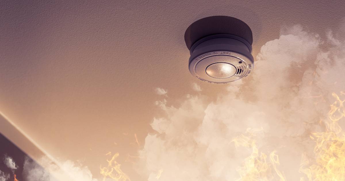 smoke alarm with smoke around it