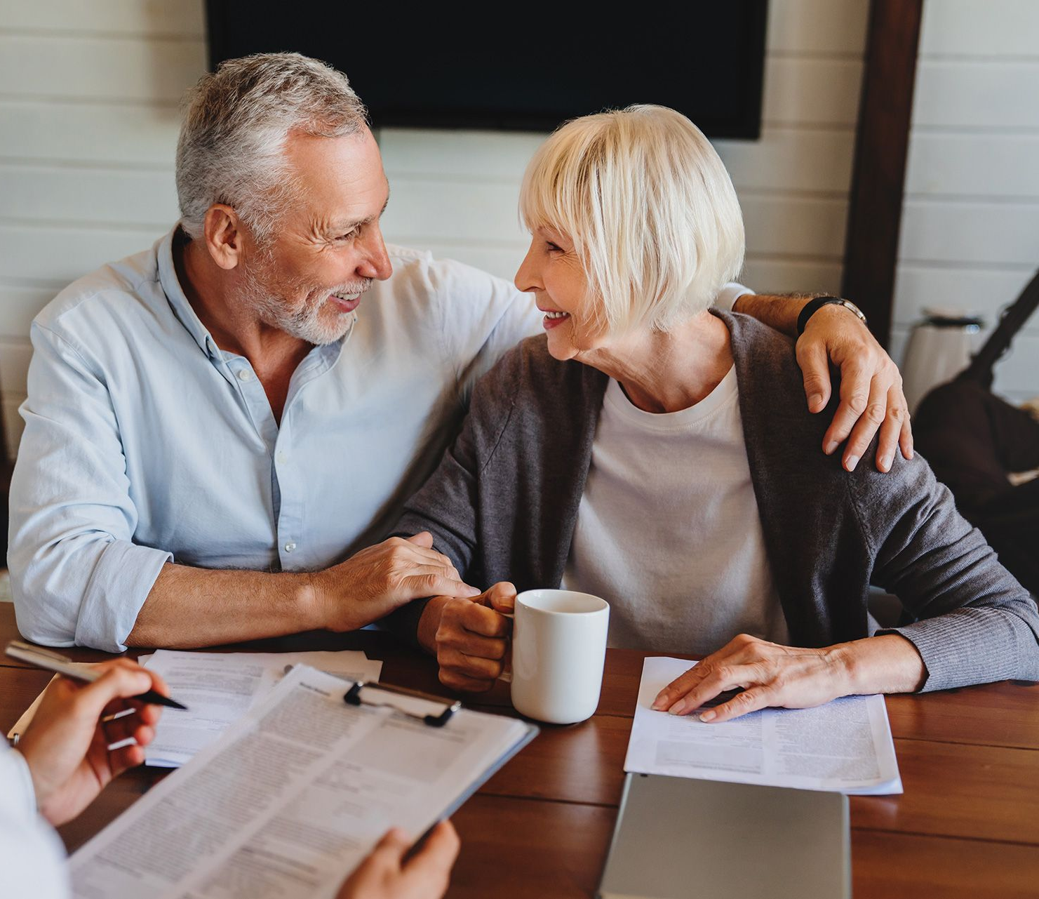 Male Caucasian specialist have meeting with mature couple