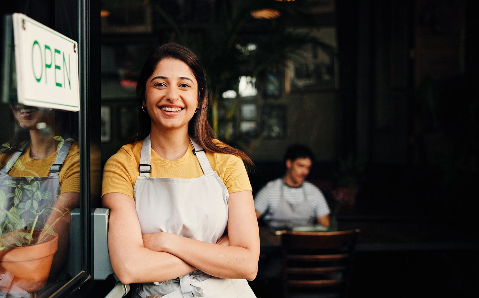Happy woman, open with confidence in cafe for small