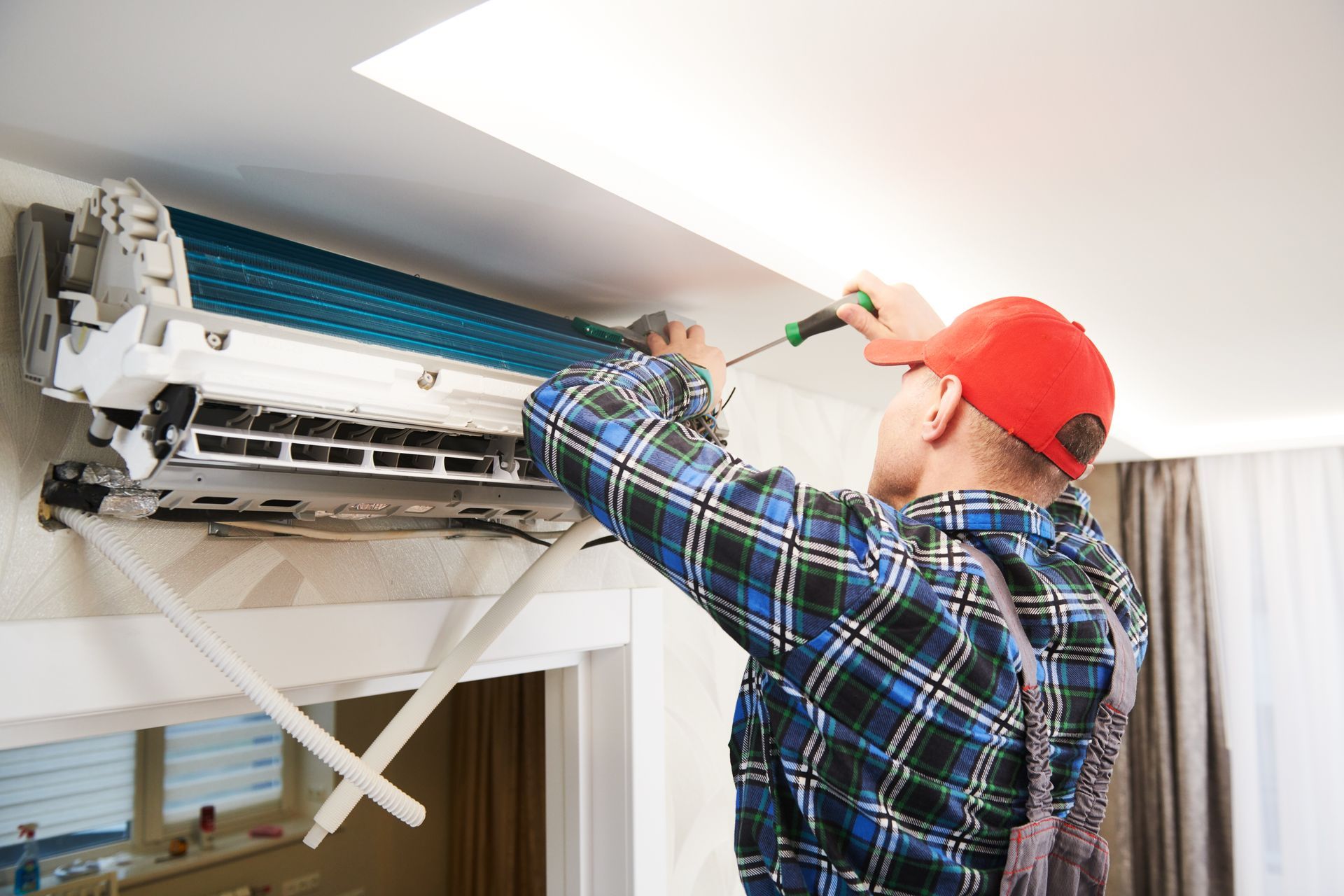technician installing mini split ac system