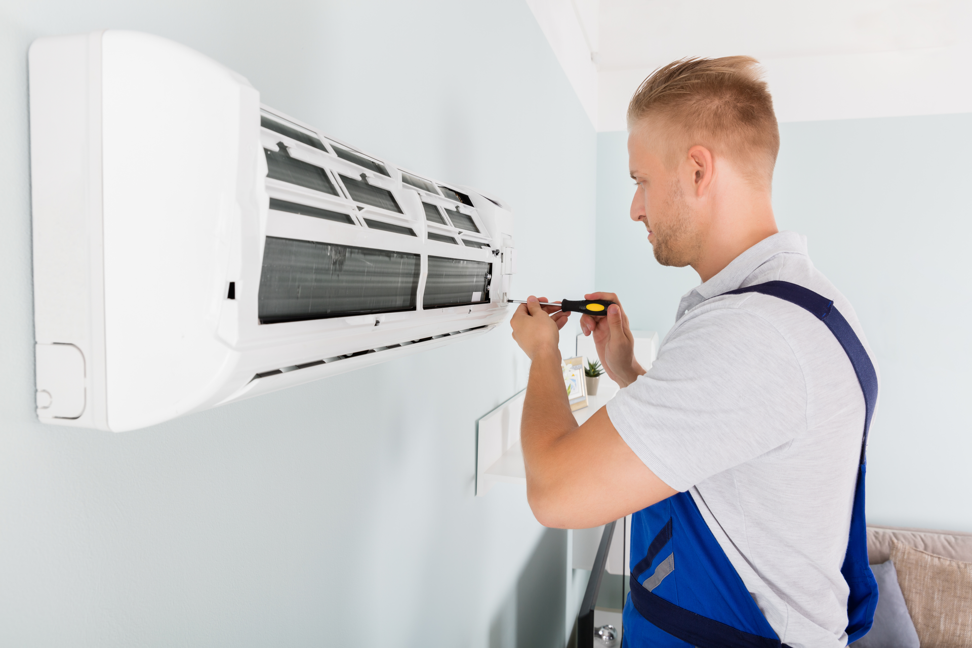 HVAC repair by skilled technician, trusted air conditioning maintenance contractor.