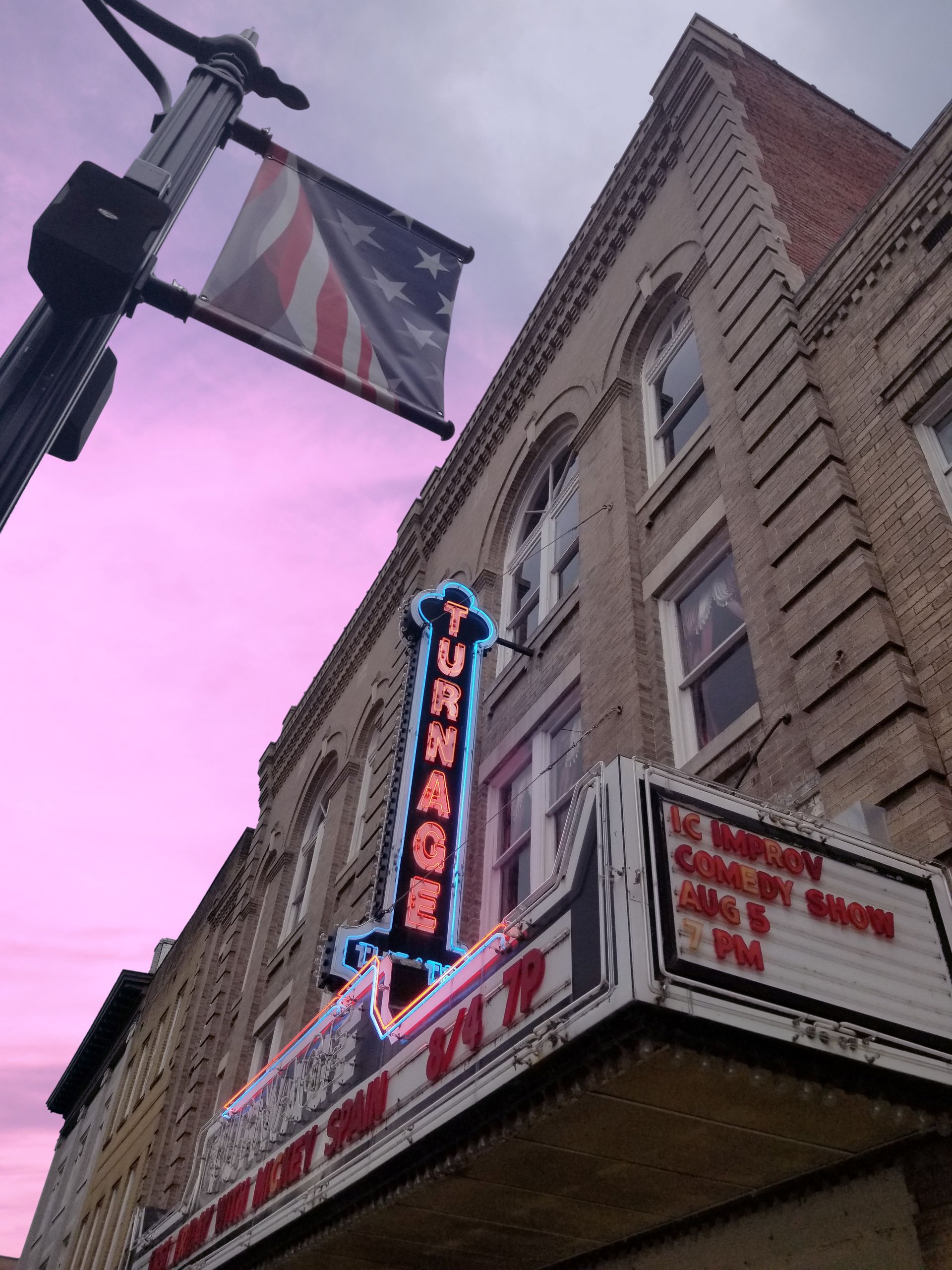 A building with a sign that says ' turnage ' on it