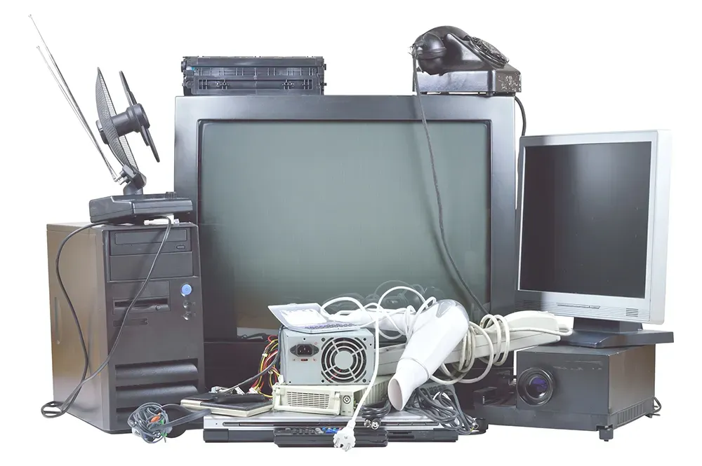 A bunch of old computer equipment including a tv