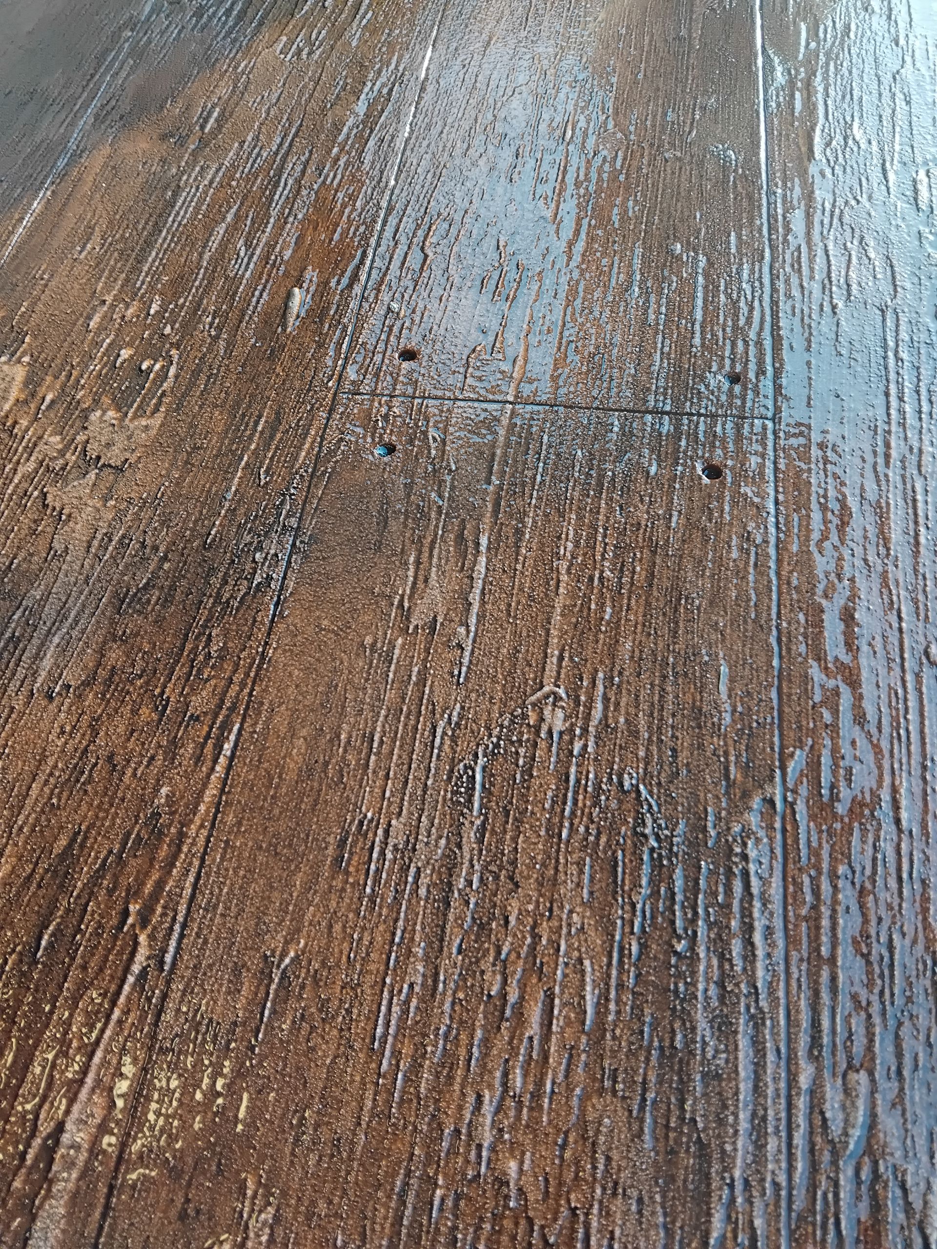 darker brown wood plank concrete finish — Troys Concrete Overlays in Hillcrest, QLD