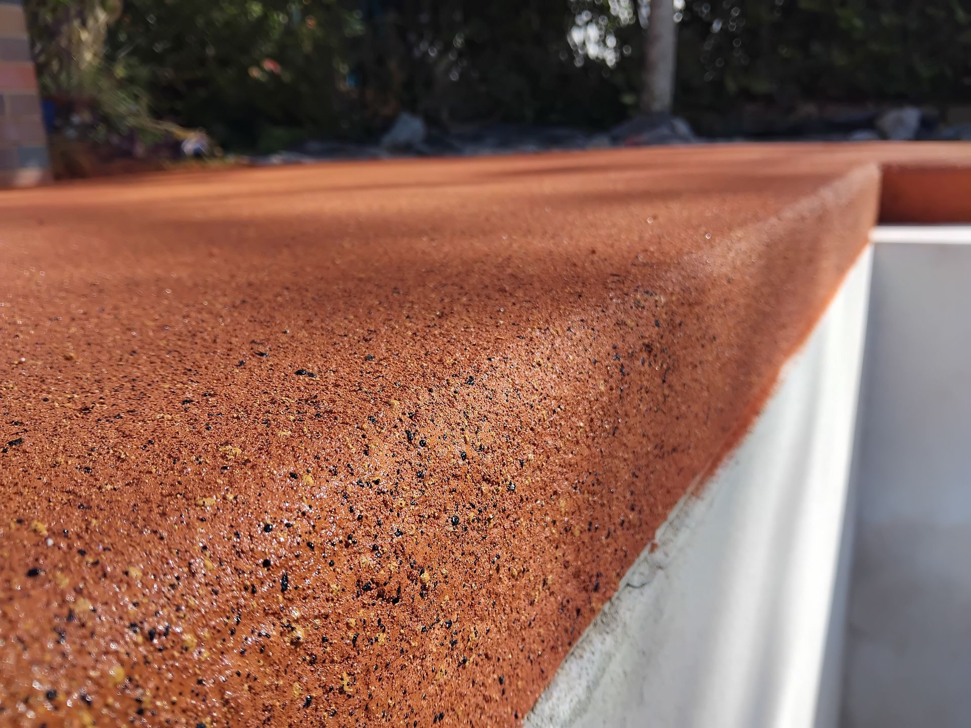 Orange resurfaced concrete — Troys Concrete Overlays in Hillcrest, QLD