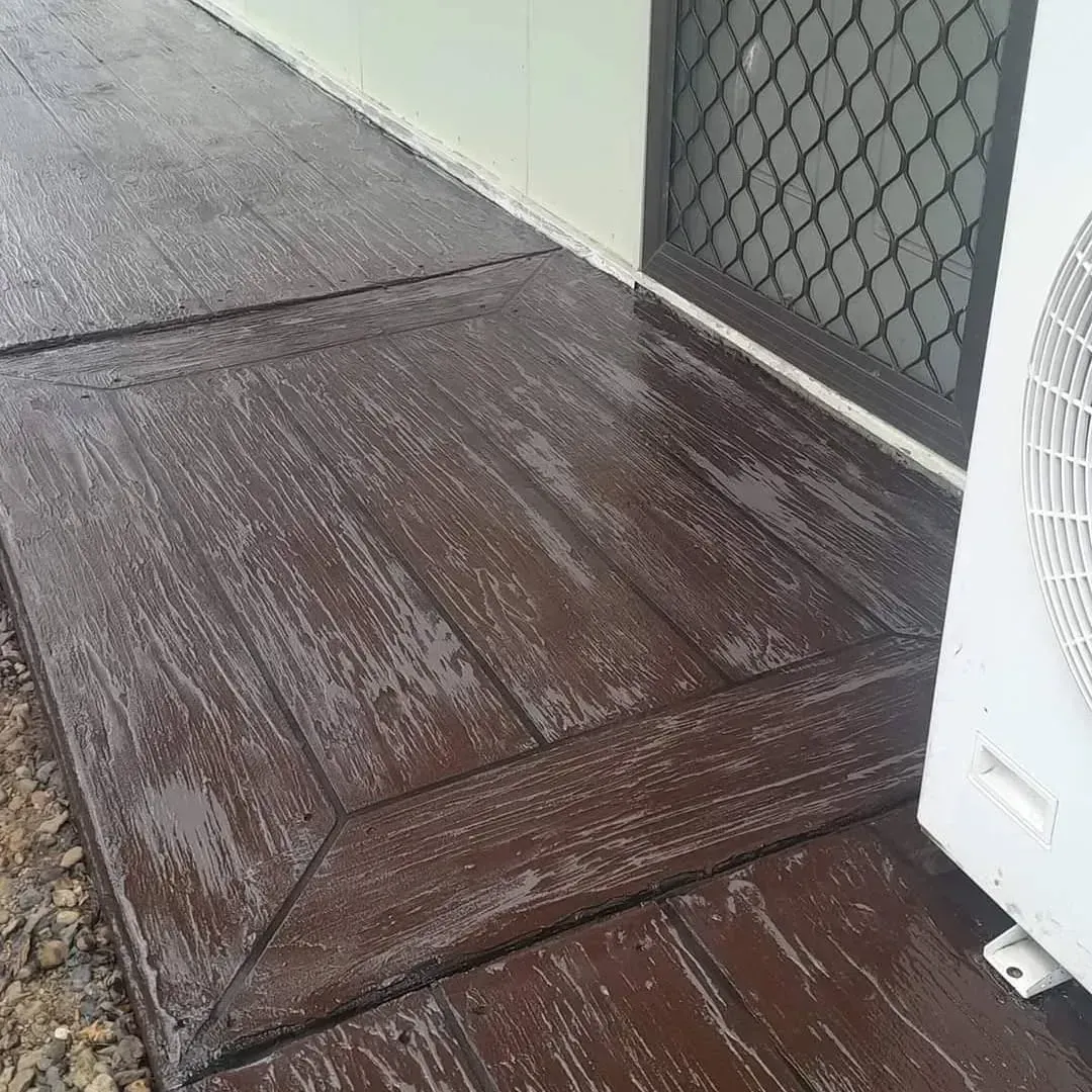 darker brown wood plank concrete finish — Troys Concrete Overlays in Hillcrest, QLD