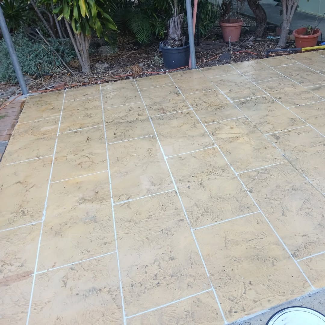 Tan-coloured Concrete Patio With Rectangular Tile Pattern — Troys Concrete Overlays in Hillcrest, QLD