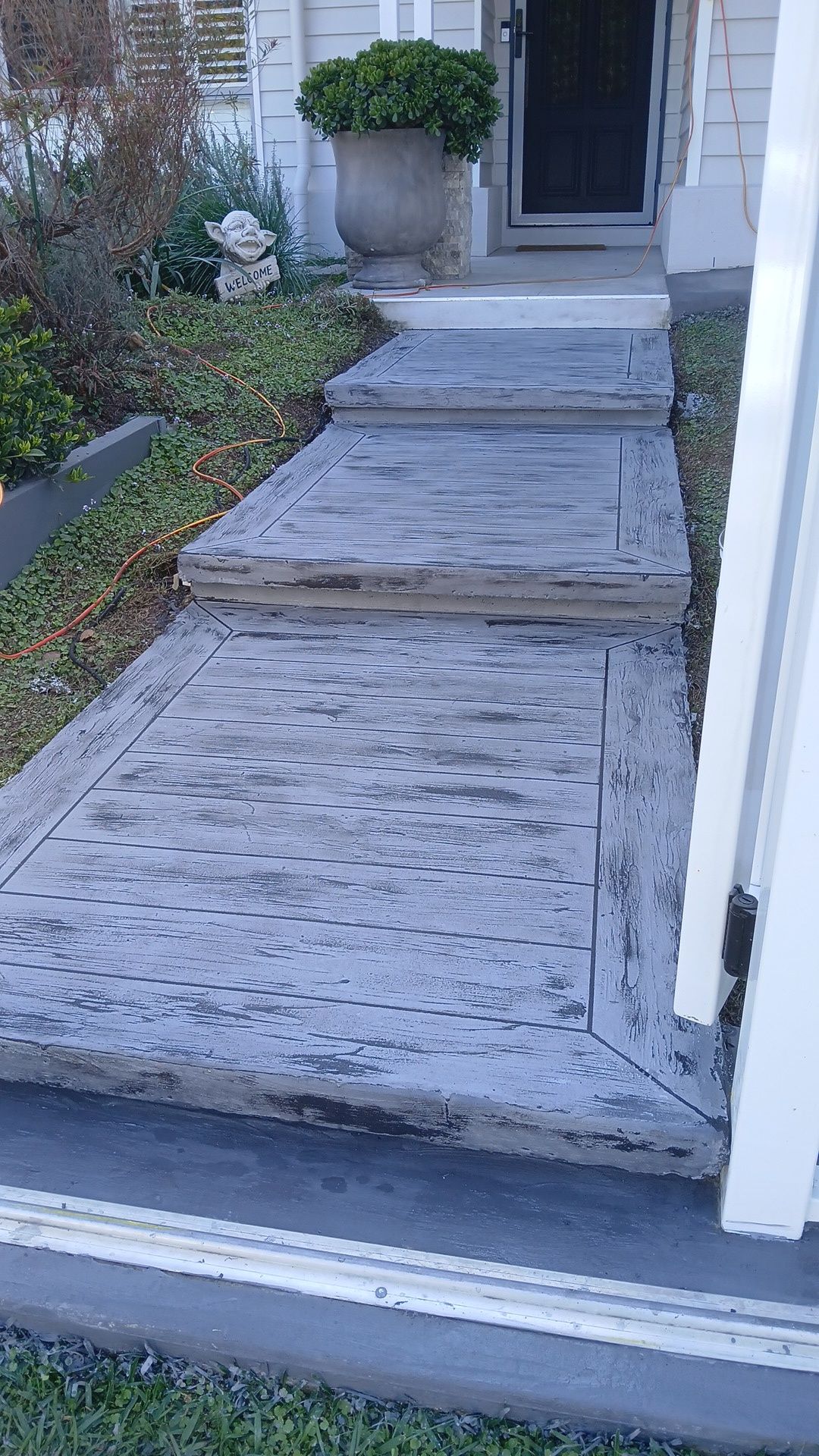 Wood plank finish concrete stairs in light grey — Troys Concrete Overlays in Hillcrest, QLD