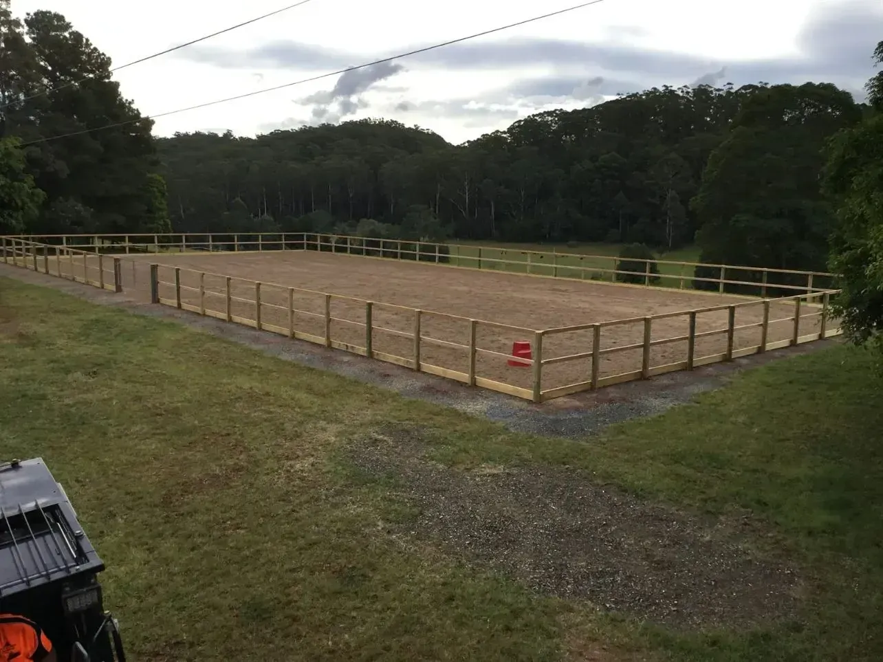 A Large Dirt In Crop Field With a Wooden Fence Around It — S M & A J Gilbert Earthmoving in Mitchells Island, NSW