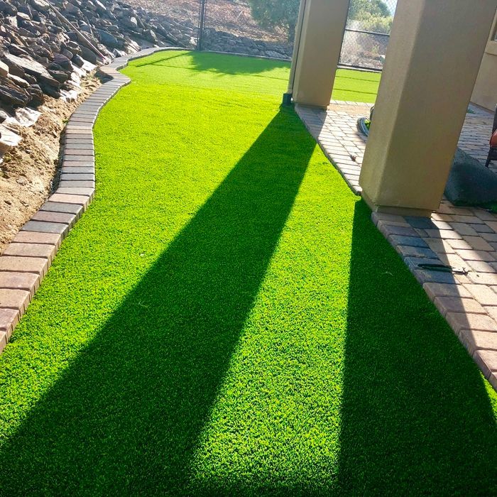 A picture of artificial turf in a backyard