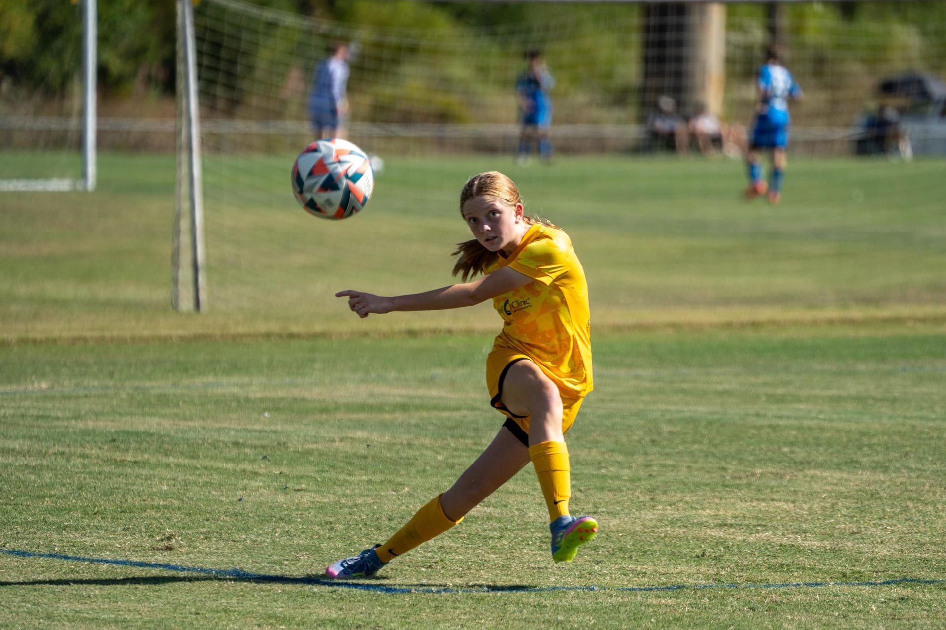 Olé FC player kicking the ball