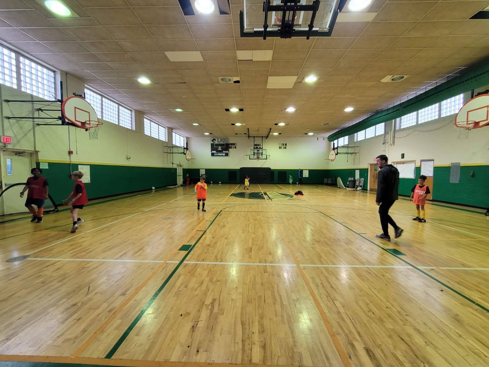 Olé FC children playing soccer indoors