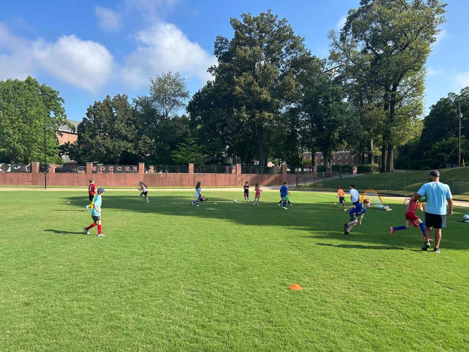 Olé FC children playing soccer on a field