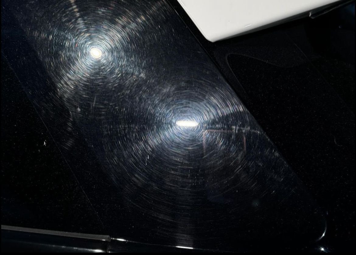 A black surface with a white stripe on it
