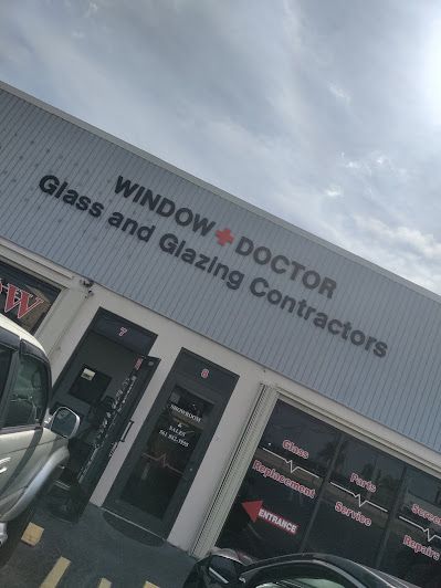 A building that says window doctor glass and glazing contractors