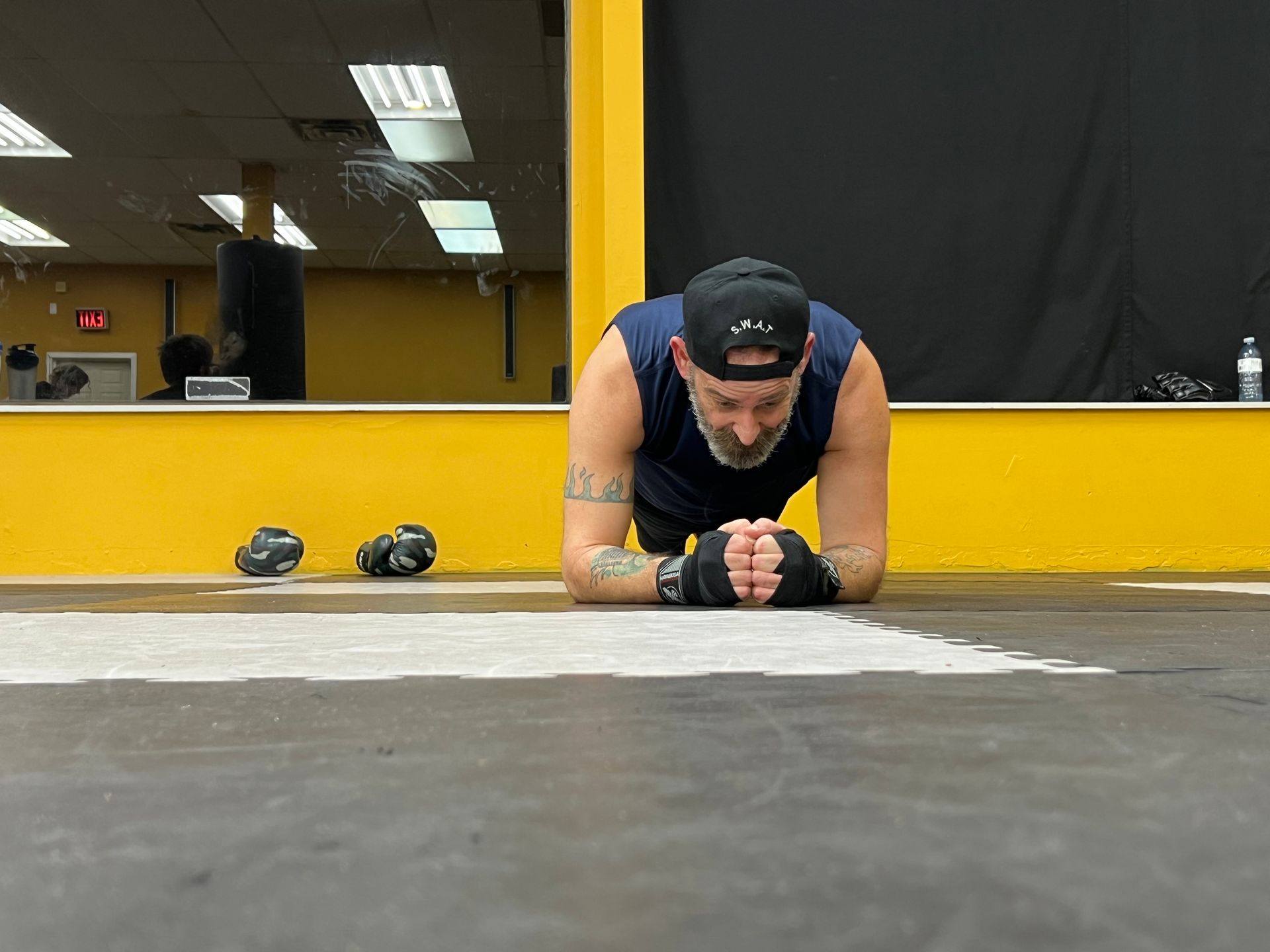 Member holding a plank during conditioning work