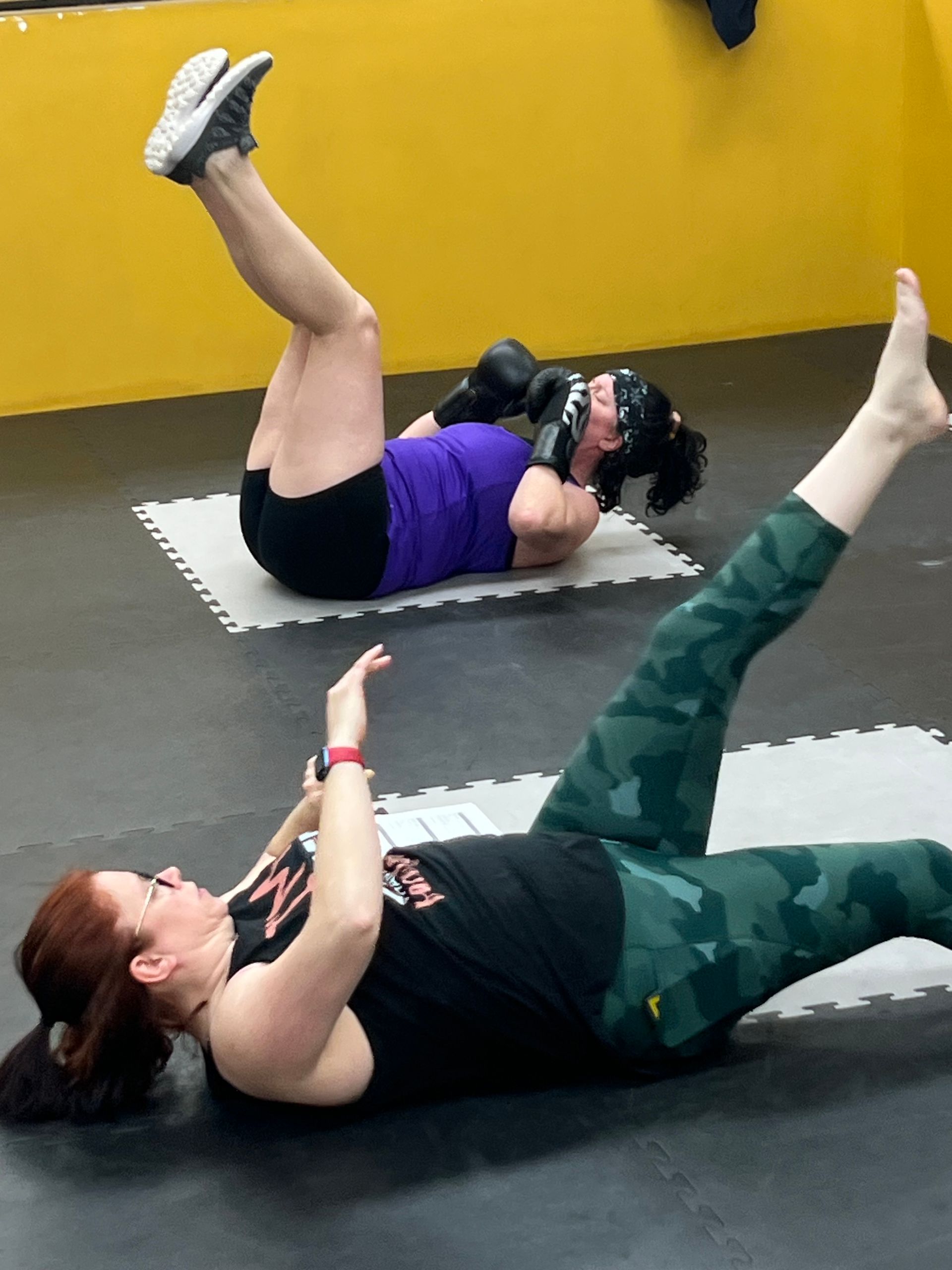 ELMA member kicking a heavy bag