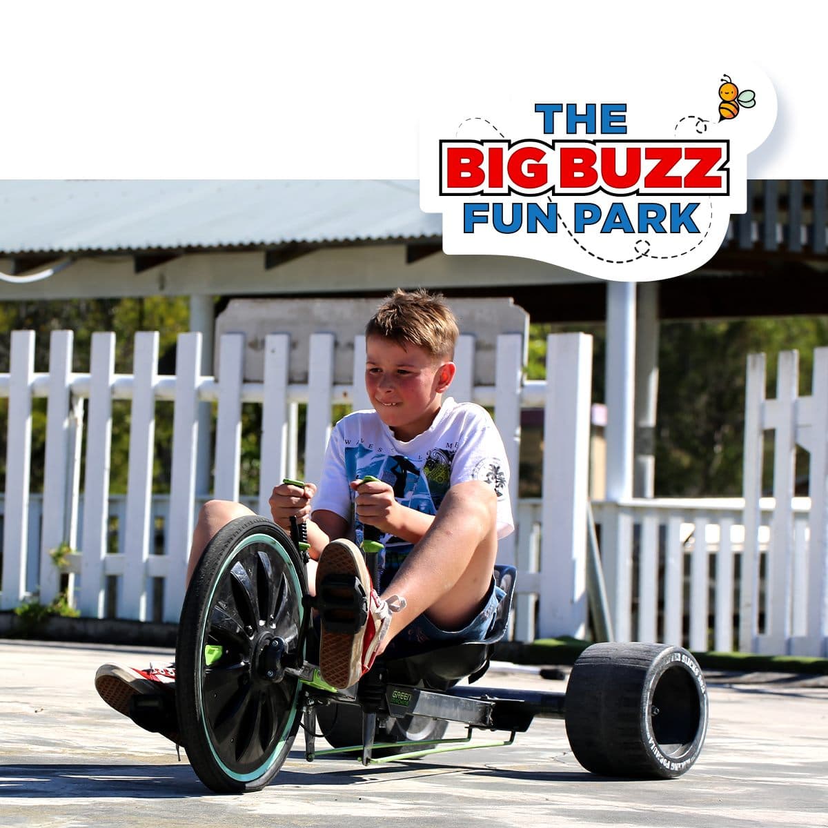 Boy Riding Carts In The Big Buzz Fun Park