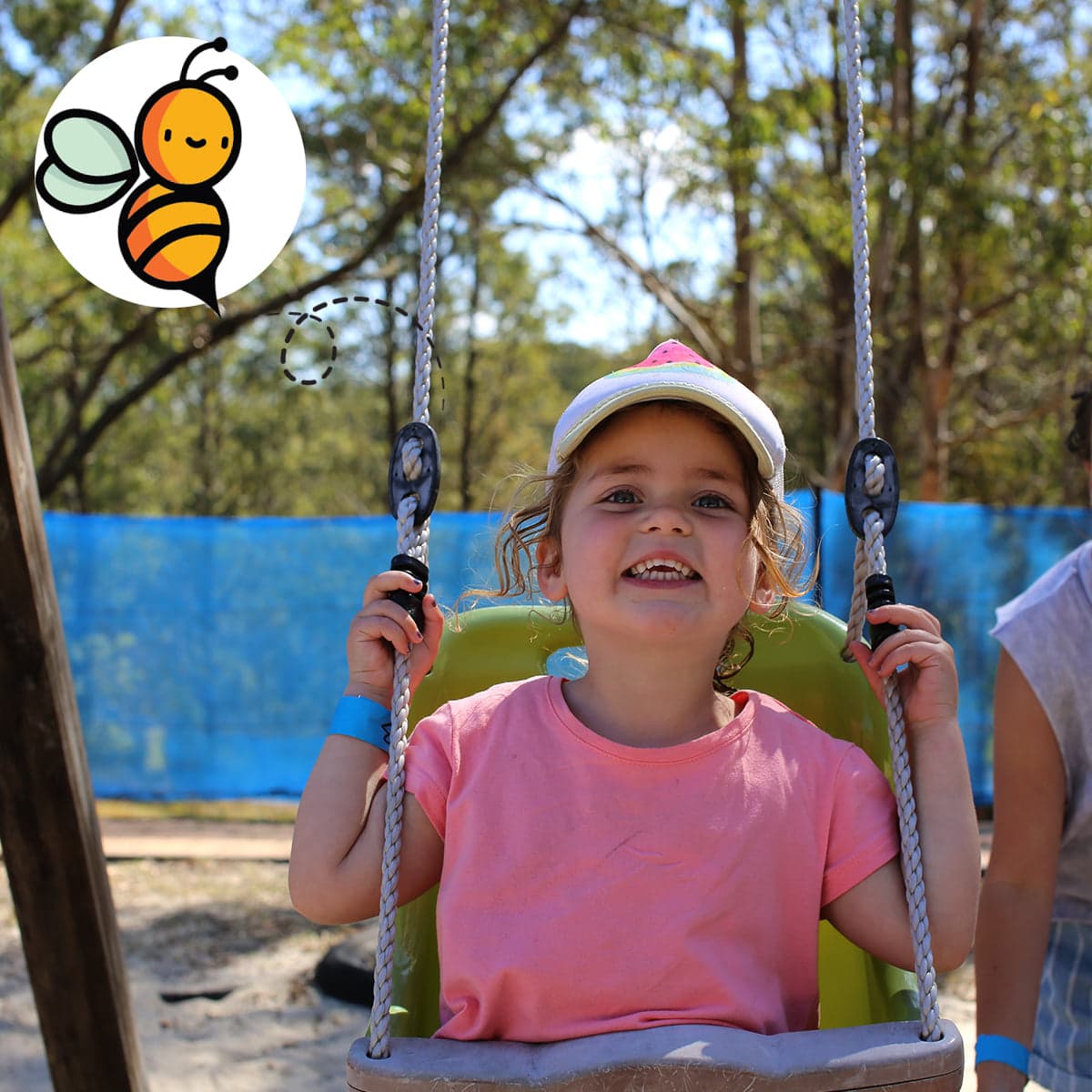 Girl in Pink Shirt Enjoying the Swing In The Big Buzz Fun Park in Rainbow Flat, NSW