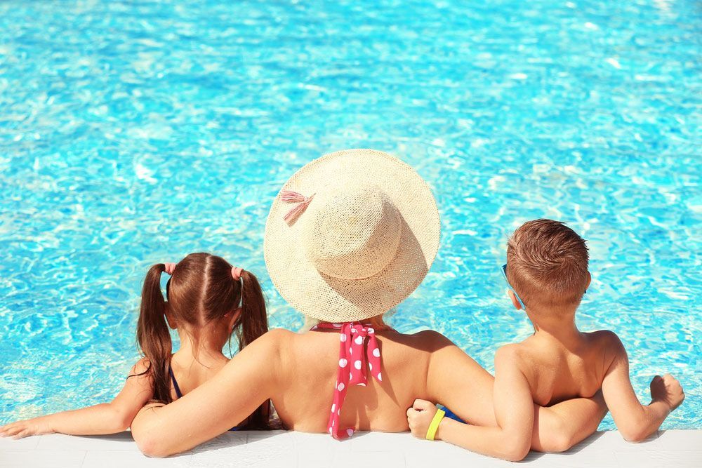 Mother With Children At Water Park