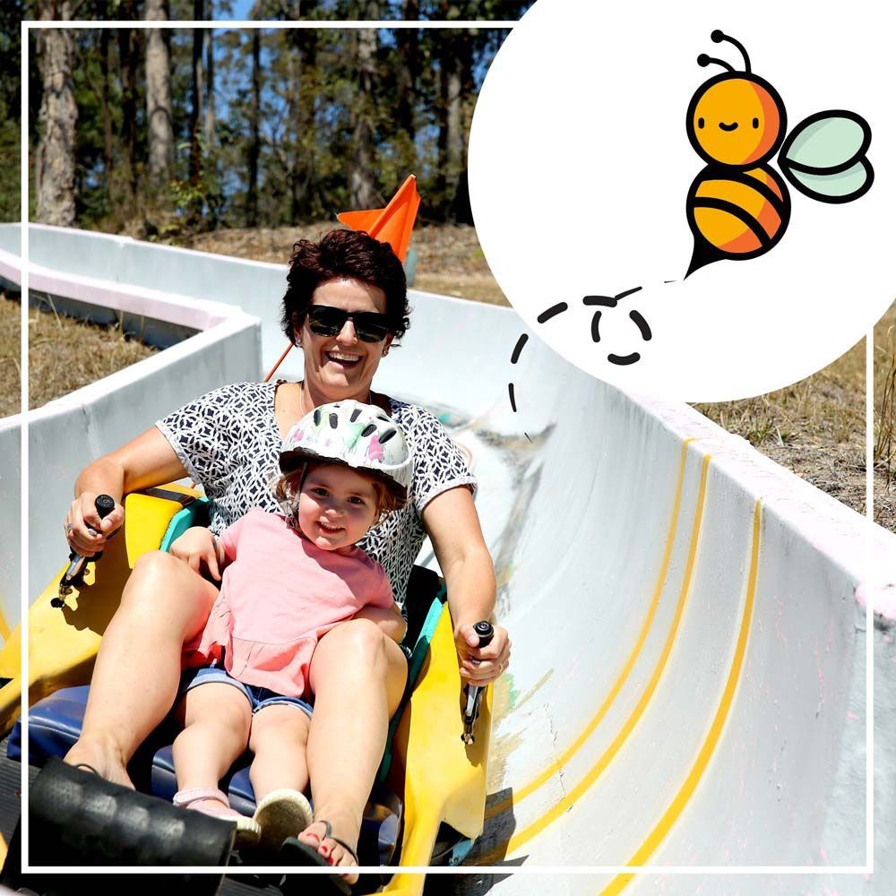 A Woman And A Little Girl On Toboggan Ride