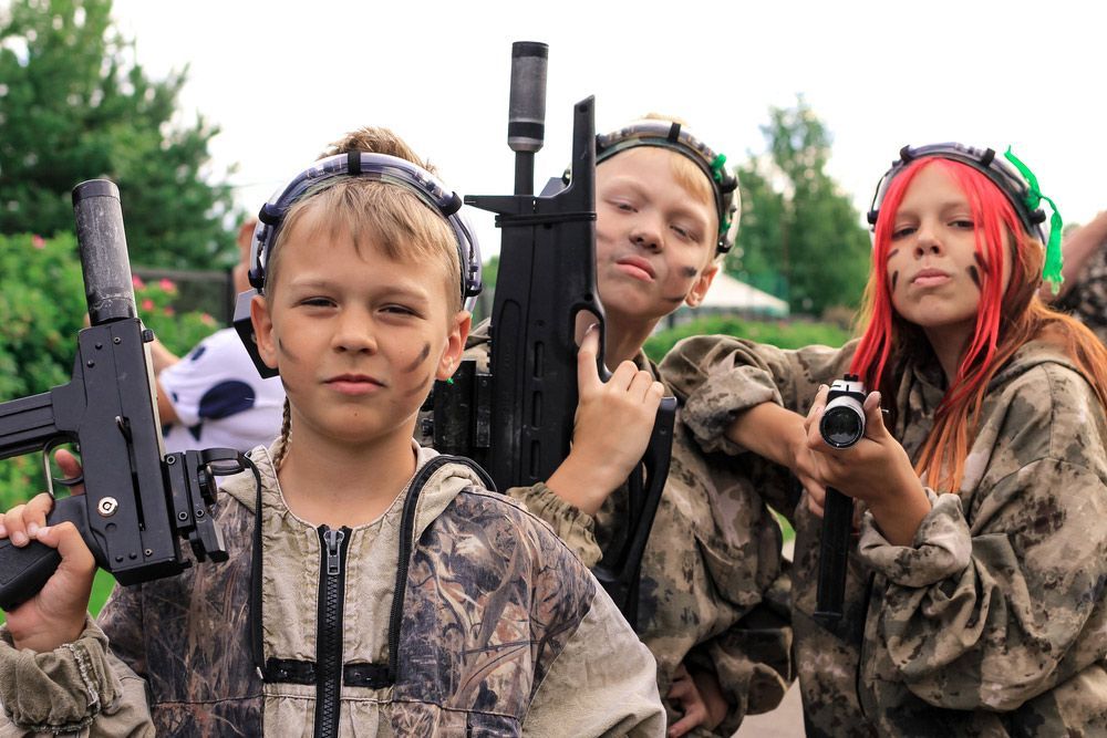 Kids Playing Laser Tag Outdoors