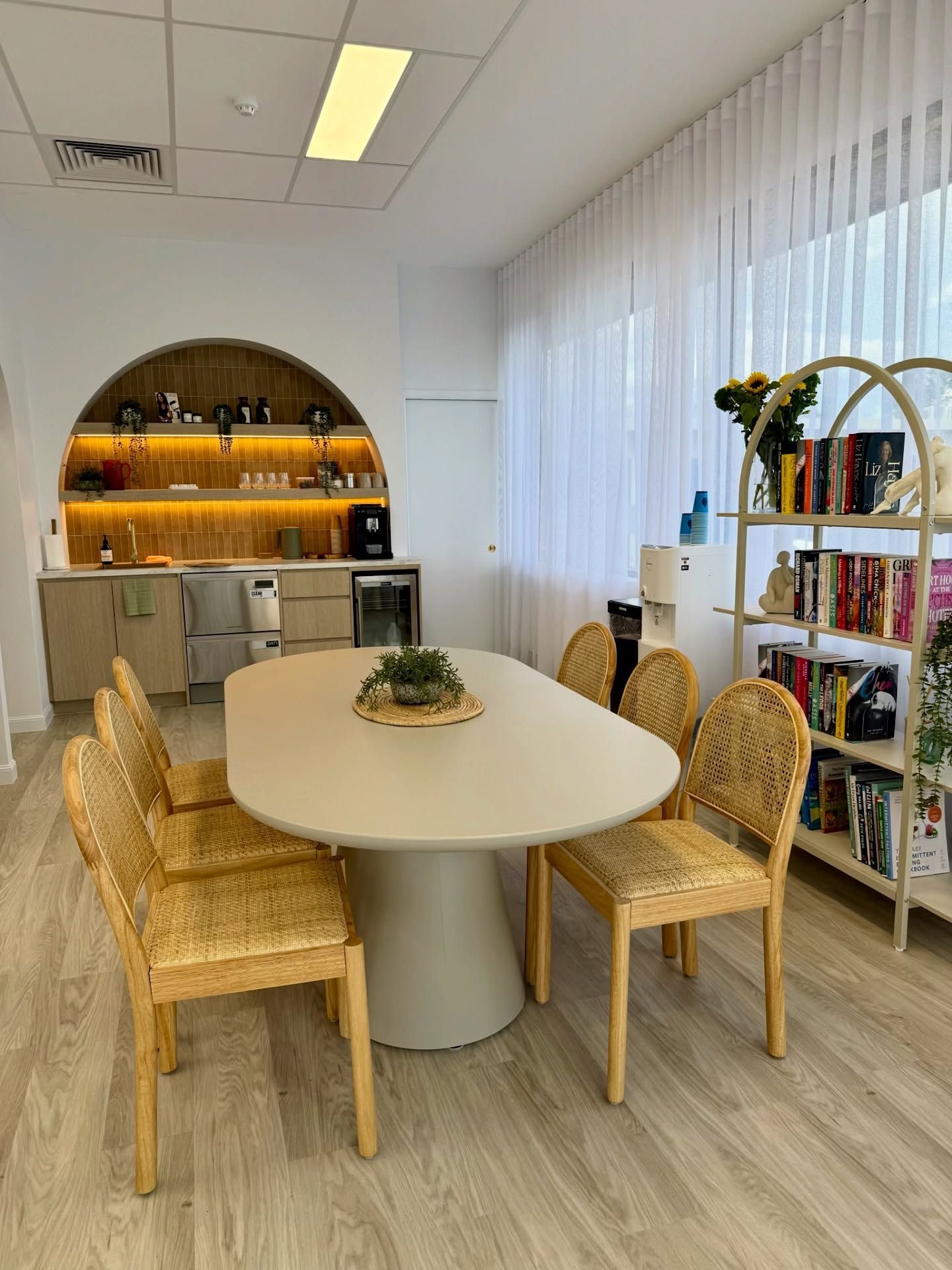 Modern Dining Area With Oval Table, Woven Chairs, Bar Shelves — Sunny State Carpentry and Joinery In Hope Island, QLD