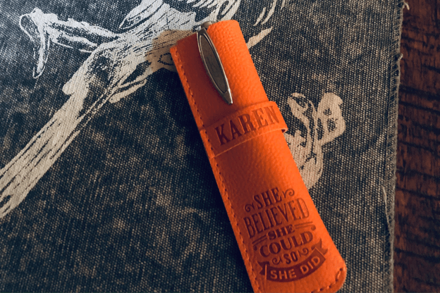 An orange bottle with the word karen on it