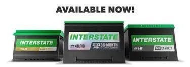 Three interstate batteries are sitting next to each other