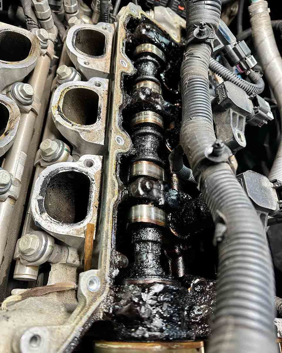A Close Up Of A Car Engine With A Lot Of Oil On It — AZNU Automotive In Lismore, NSW