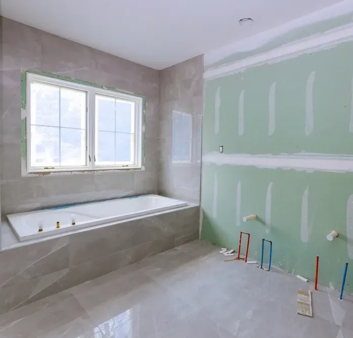 A Bathroom Being Renovated with Water Pipes for Vanity — Canberra Bathroom Solutions in Queanbeyan, NSW