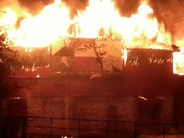 a picture of a house on fire.