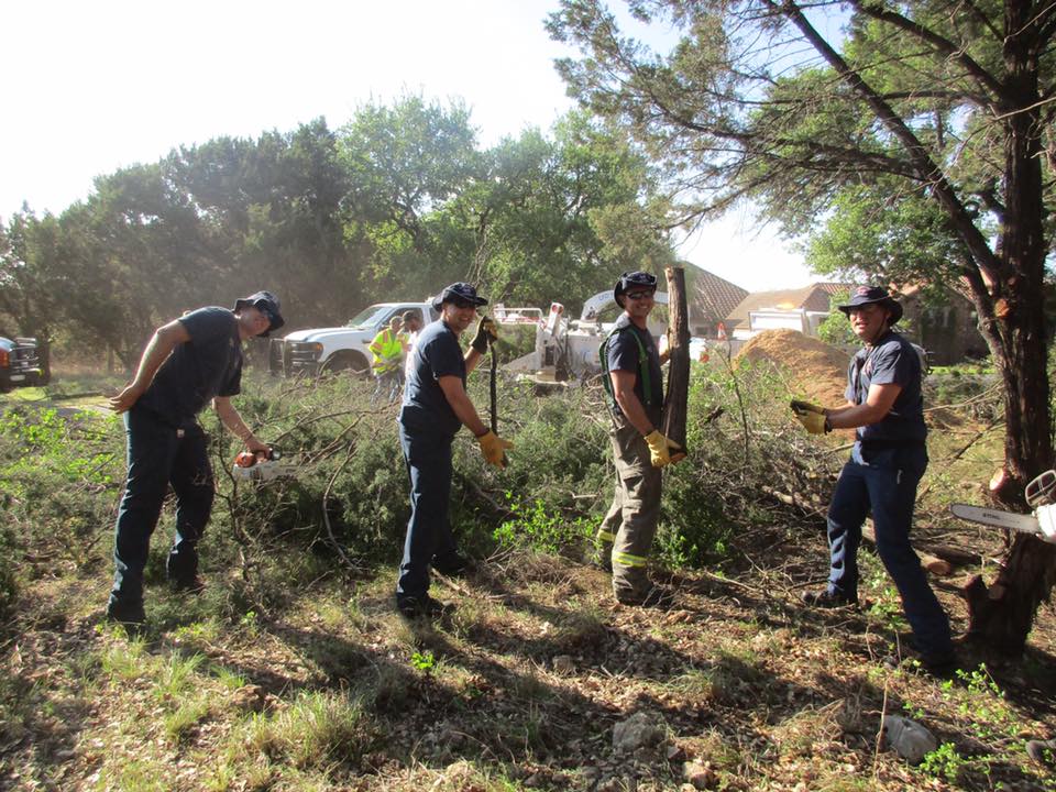 A group of men are working in a field.