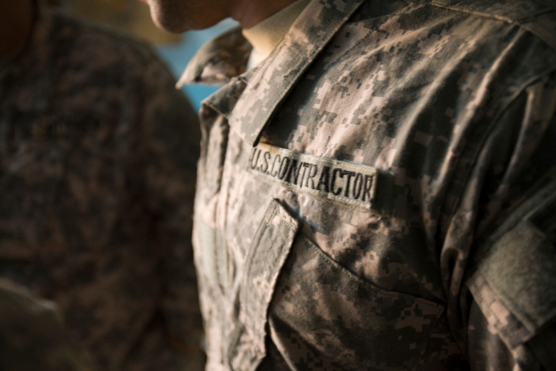 Close-up of a person in camouflage uniform with