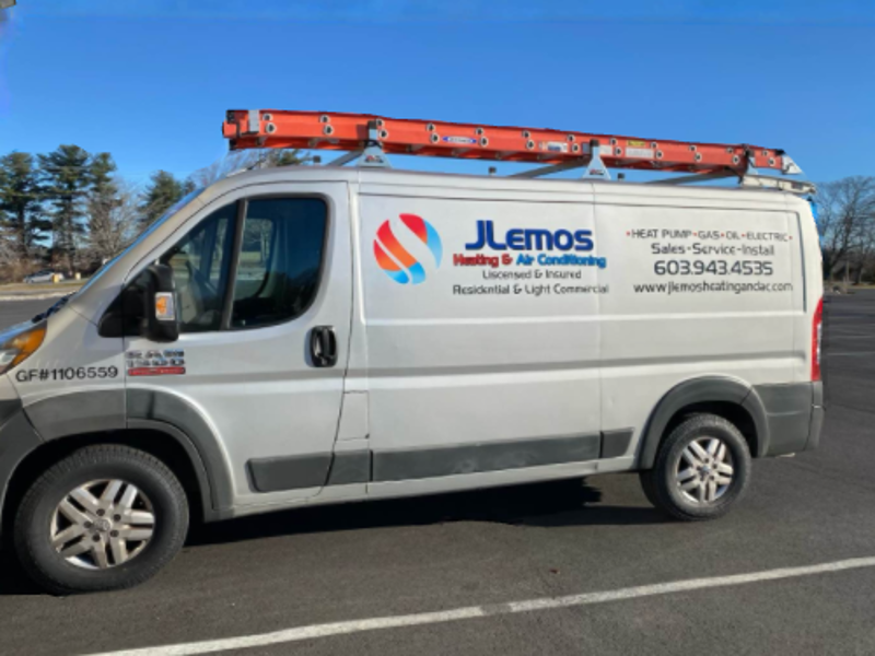 a j.e.mos van is parked in a parking lot