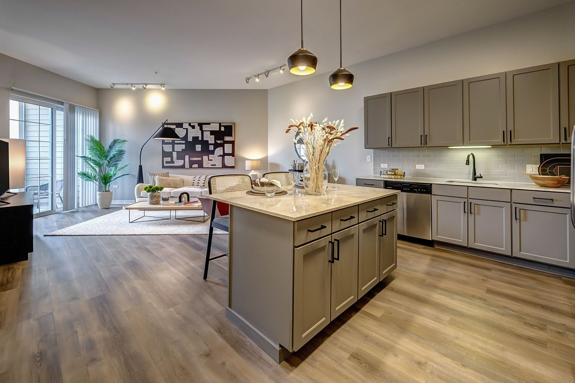A kitchen with a large island in the middle of the room.
