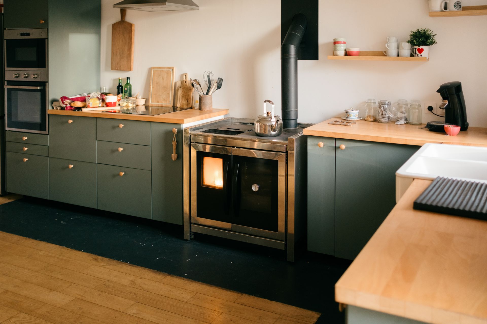 Modern farmhouse kitchen with wood stove. Modern farmhouse kitchen with wood stove.