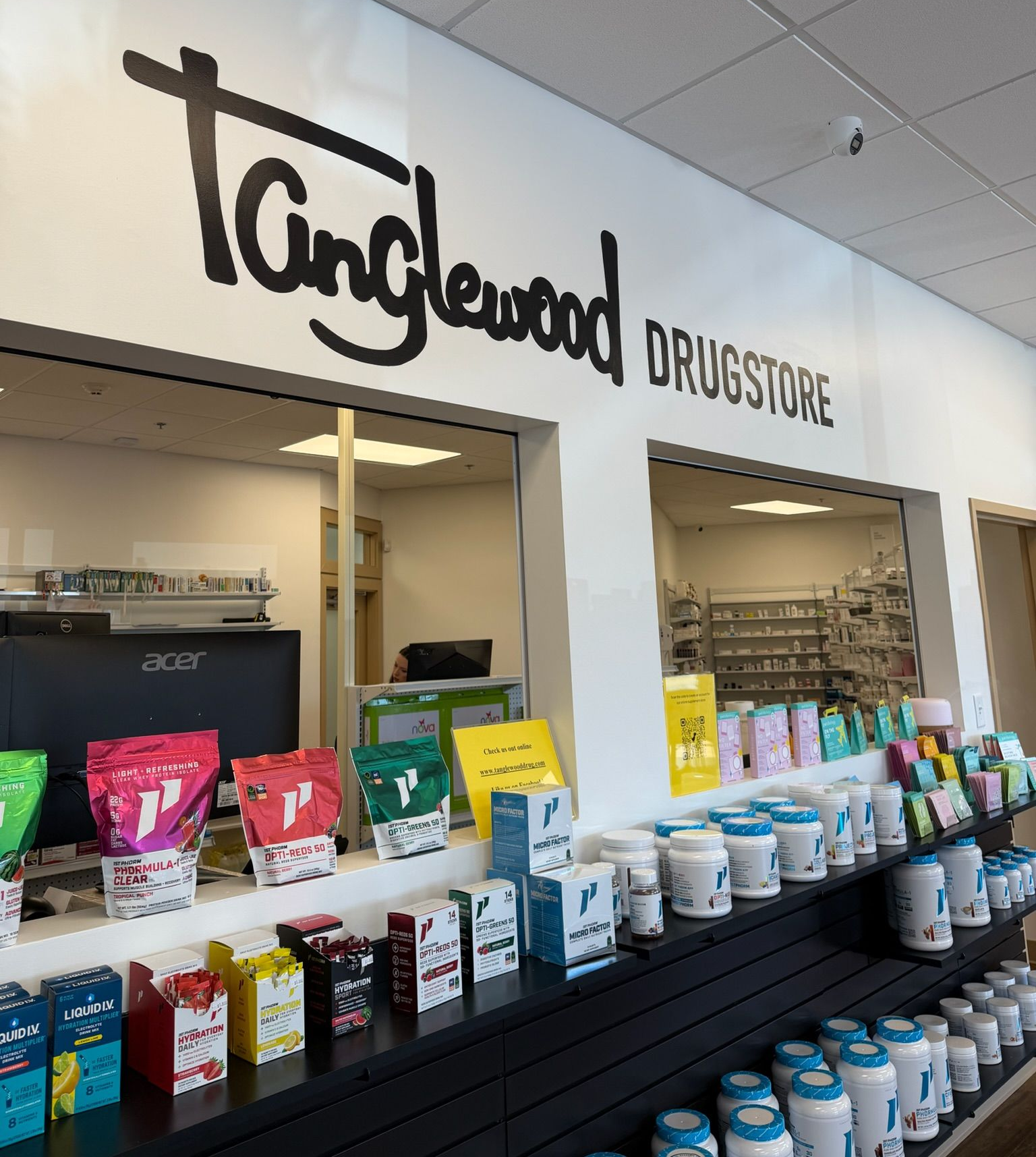 Tanglewood Pharmacy storefront with shelves of 1st Phorm products.
