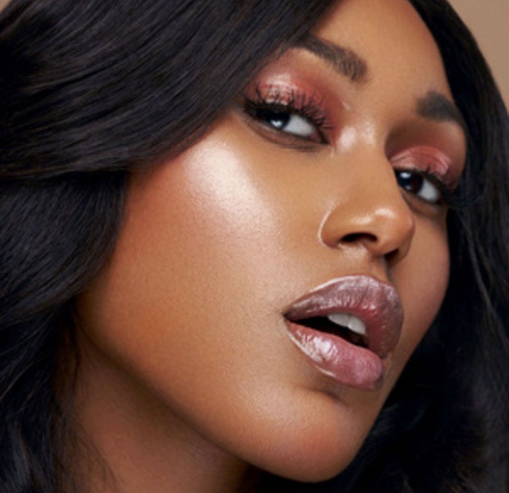 A close up of a woman 's face with makeup on
