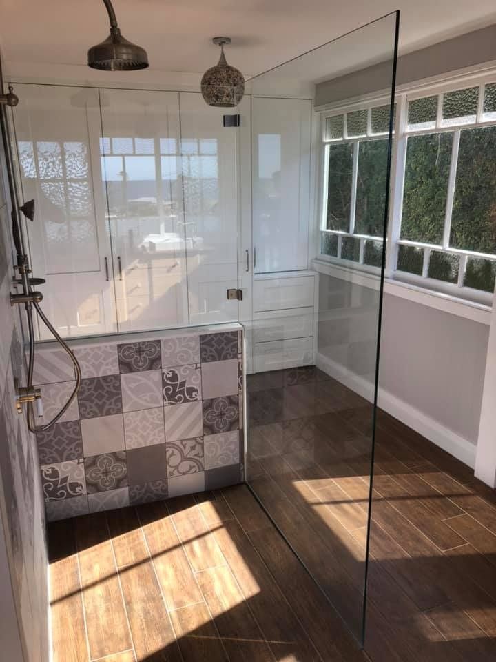 A Bathroom with A Walk in Shower and A Glass Door — Gads Glass & Shower Screens in Albion Park, NSW