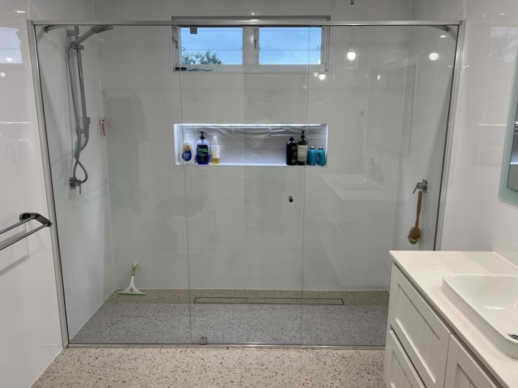 A Bathroom with A Walk in Shower and A Sink — Gads Glass & Shower Screens in Kiama, NSW