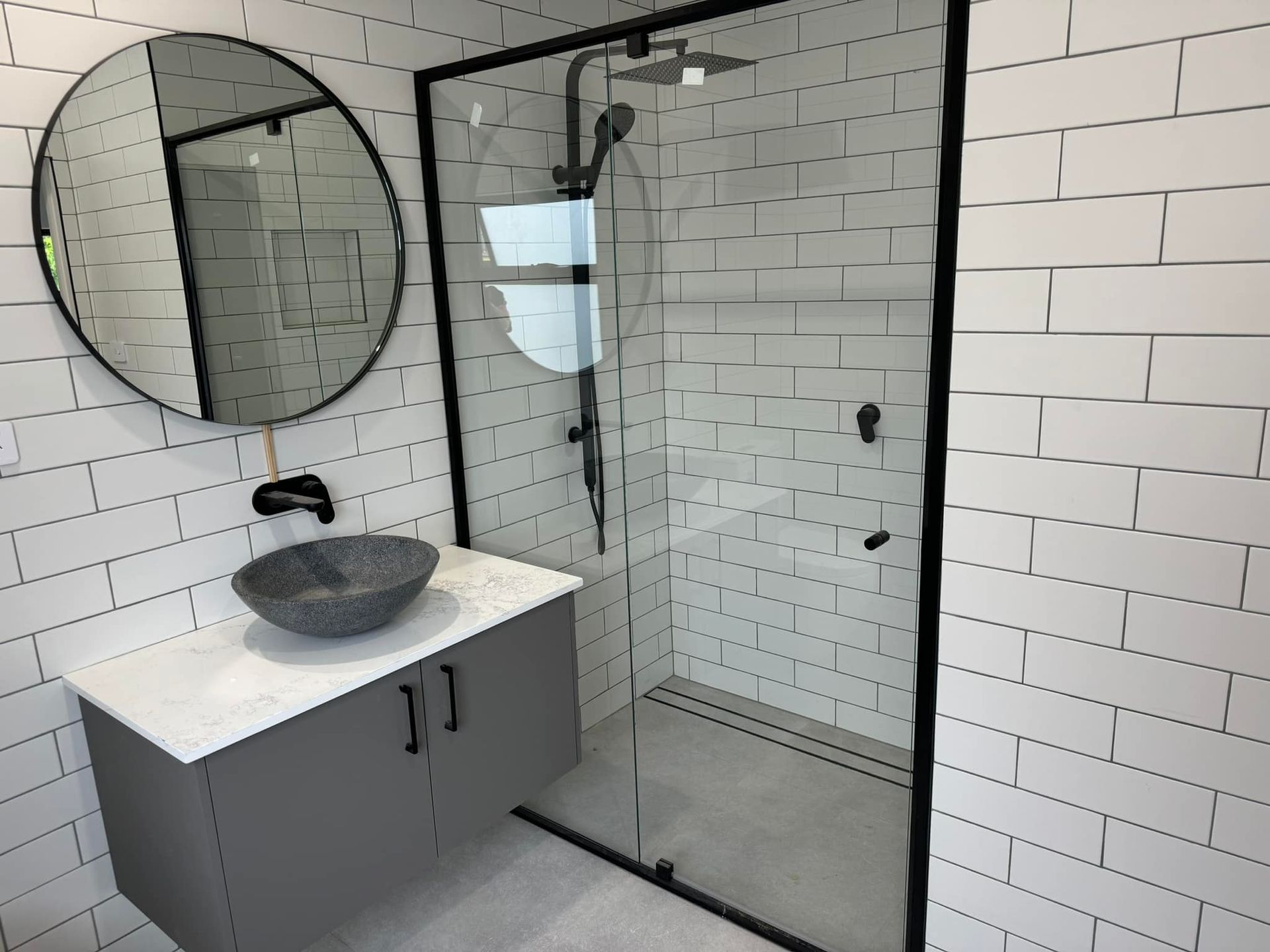 A Bathroom with A Shower Stall, mirror and A Sink — Gads Glass & Shower Screens in Shellharbour, NSW