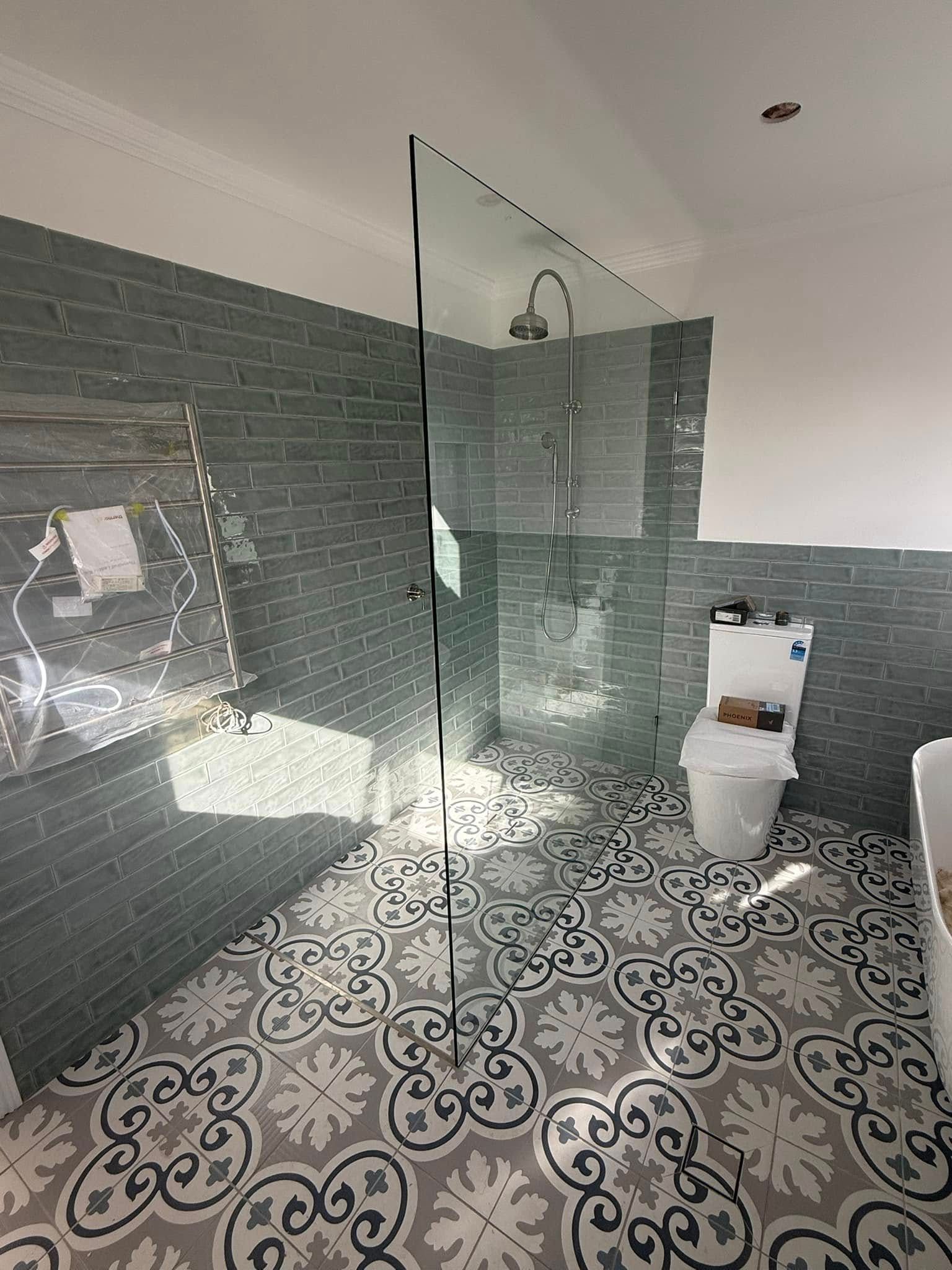 A Bathroom with A Bathtub, Sink and Shower — Gads Glass & Shower Screens in Kiama, NSW