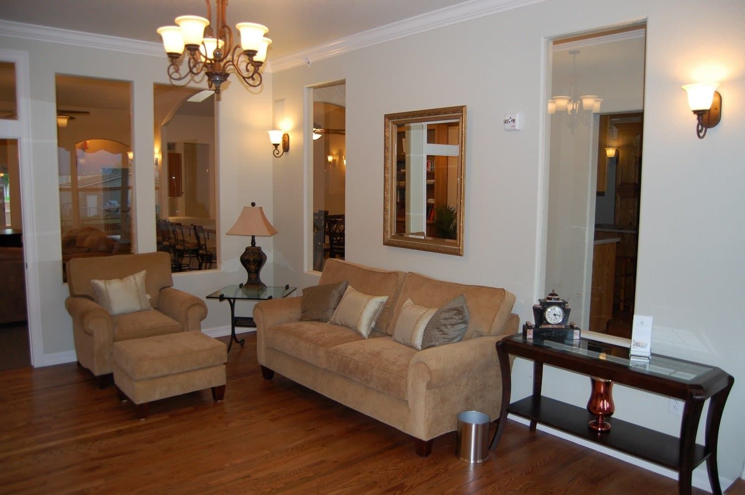 A living room with a couch and two chairs